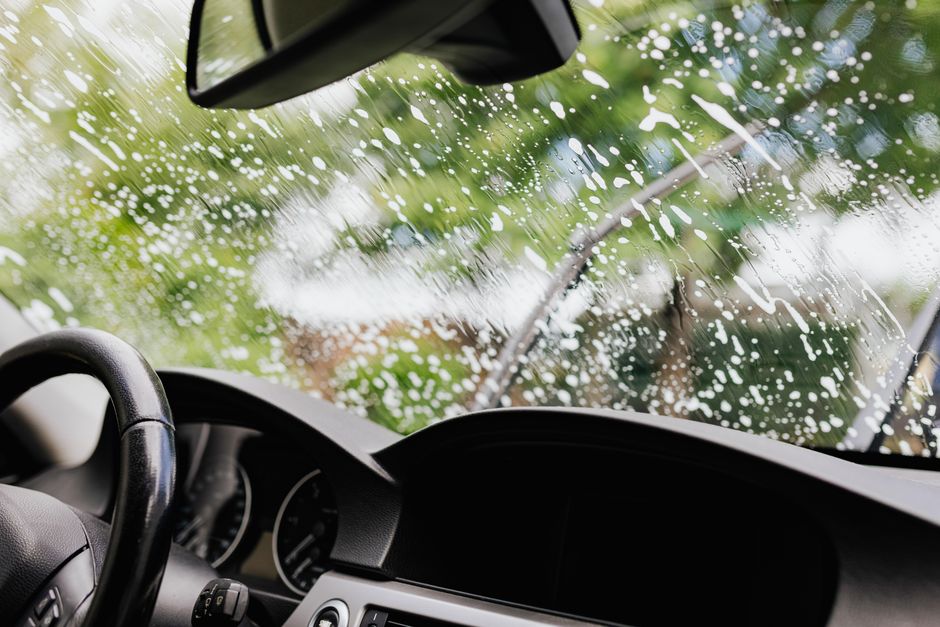 Brand new, sparkling clean car window newly installed on a modern vehicle